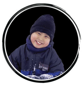 boy smiling in winter coat